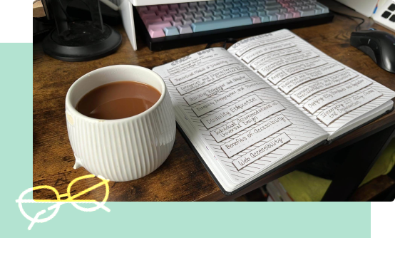 accessibility notes and mug with tea on a wooden desk 